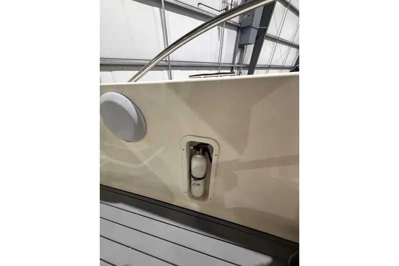 Slide: The Image of 1999 Pursuit 2870 Center Console boat interior with speaker and seating. - 27