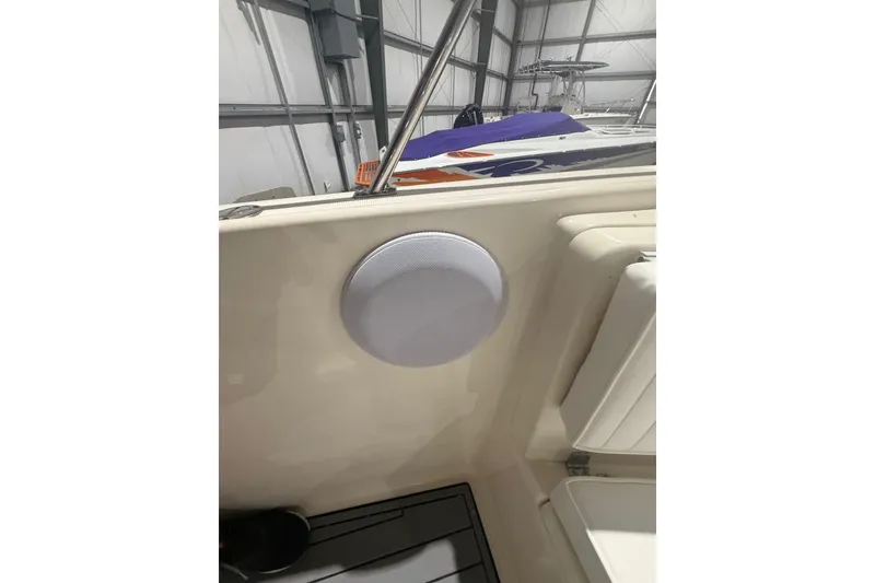 Slide: The Image of 1999 Pursuit 2870 Center Console boat deck with anchor chain and winch. - 29
