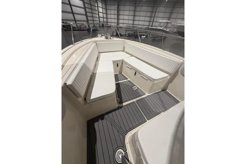 Slide: The Image of Trailer for 1999 Pursuit 2870 Center Console boat with triple axles in a parking area. - 32