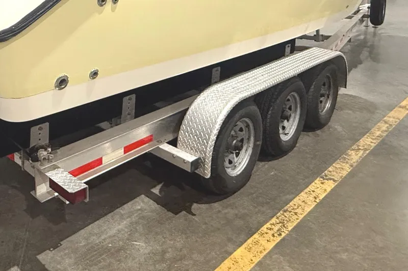 Slide: The Image of 1999 Pursuit 2870 Center Console with twin Yamaha 250 V6 engines in a storage facility. - 34