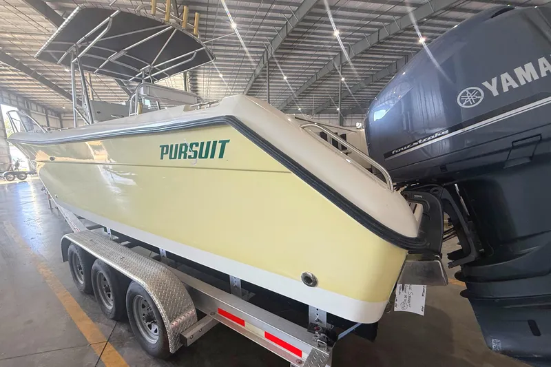 Slide: The Image of 1999 Pursuit 2870 Center Console boat with visible serial number and hardware details. - 38