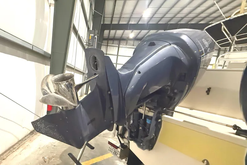 Slide: The Image of 1999 Pursuit 2870 Center Console boat engine in a storage facility. - 4