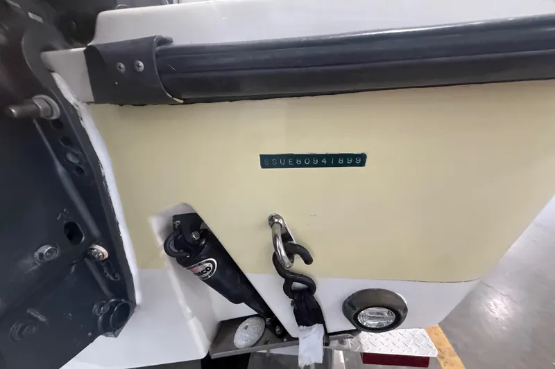 Slide: The Image of 1999 Pursuit 2870 Center Console boat on trailer in indoor storage facility. - 40