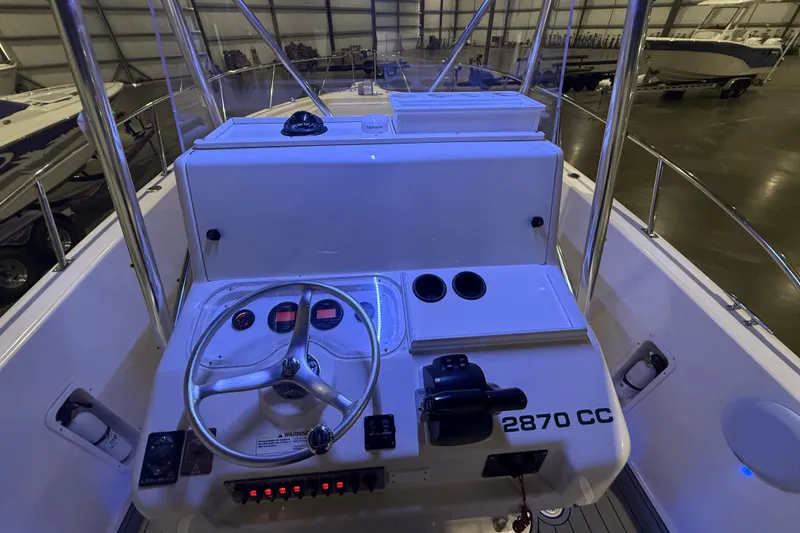 Slide: The Image of 1999 Pursuit 2870 Center Console dashboard with steering wheel, controls, and navigation display. - 6