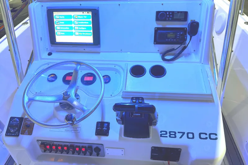 Slide: The Image of Interior cabin view of a 1999 Pursuit 2870 Center Console boat. - 7
