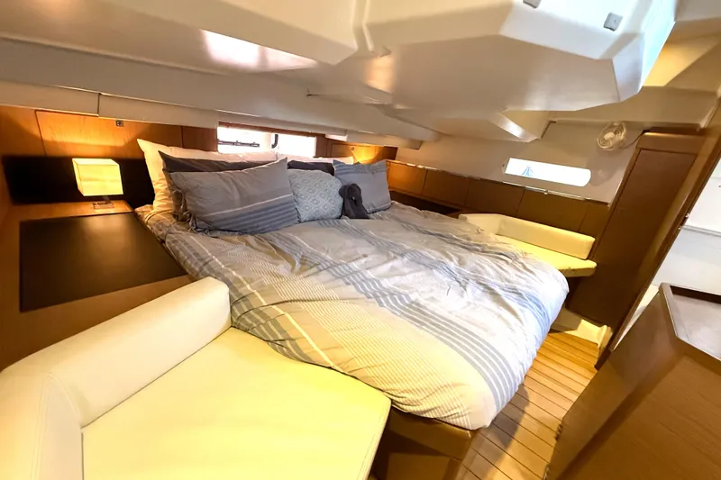 Slide: The Image of Luxurious cabin interior of 2013 Jeanneau Sun Odyssey 44 DS yacht with cozy bedding. - 11