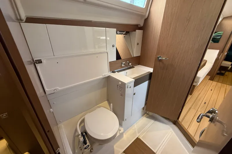 Slide: The Image of Bathroom interior of 2013 Jeanneau Sun Odyssey 44 DS yacht, featuring modern fixtures and wood accents. - 12