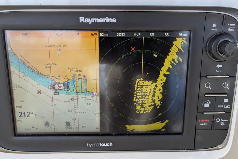 Slide: The Image of Raymarine navigation display on 2013 Jeanneau Sun Odyssey 44 DS, showing nautical chart and radar. - 14