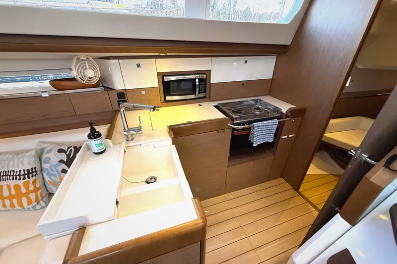 Slide: The Image of Interior of 2013 Jeanneau Sun Odyssey 44 DS yacht kitchen with modern amenities. - 9