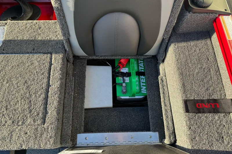 Slide: The Image of 2026 Lund 1775 Adventure Sport boat battery compartment with Interstate battery. - 15