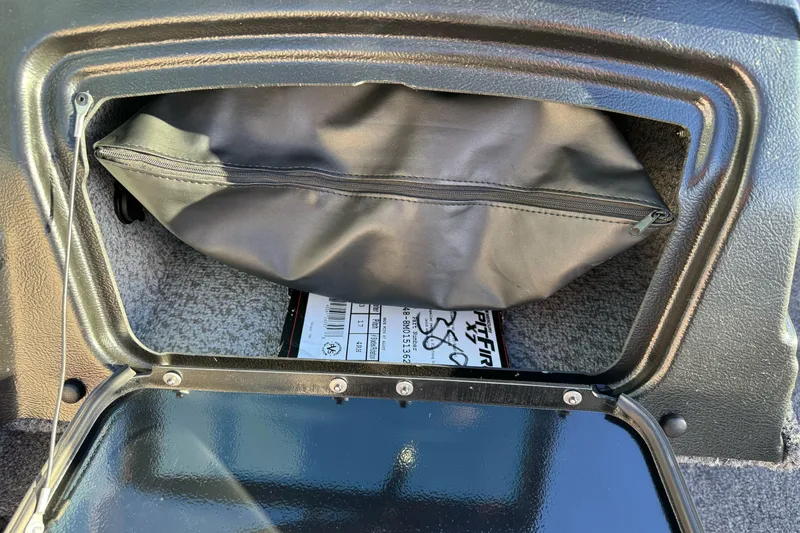 Slide: The Image of Storage compartment in 2026 Lund 1775 Adventure Sport boat, featuring a zippered pouch. - 17