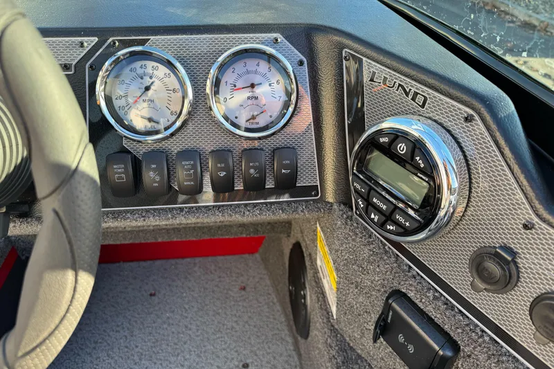 Slide: The Image of Dashboard of 2026 Lund 1775 Adventure Sport boat with gauges and controls. - 19
