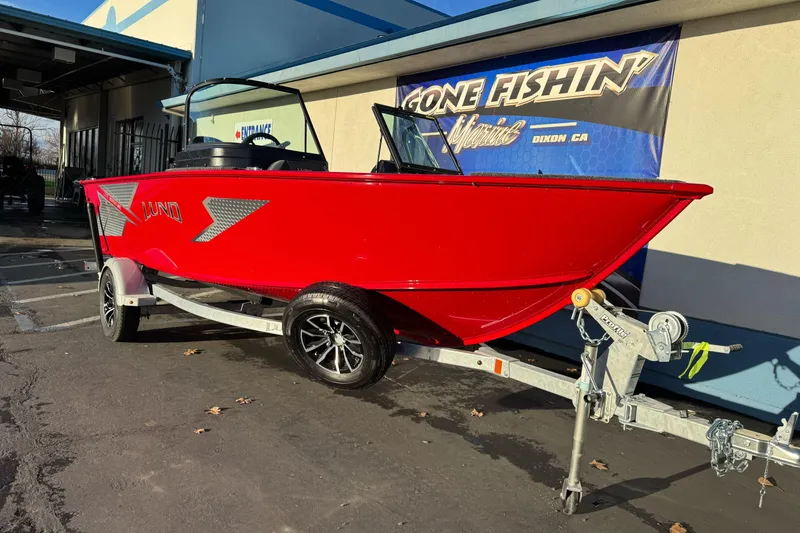 Slide: The Image of 2026 Lund 1775 Adventure Sport boat in vibrant red on a trailer. - 4