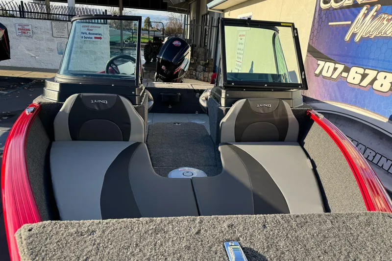 Slide: The Image of 2026 Lund 1775 Adventure Sport boat interior with seating and windshield. - 6