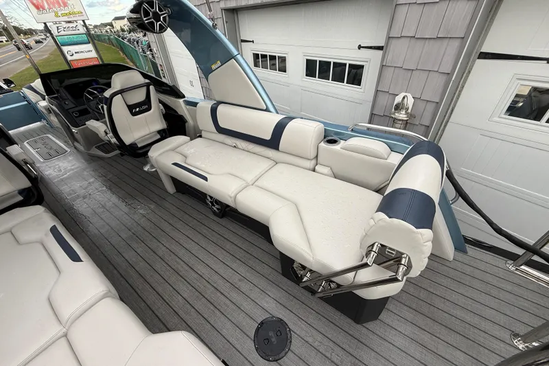 Slide: The Image of 2026 Avalon 2585 Excalibur Windshield Quad Lounger interior, featuring luxurious seating and modern dashboard. - 14