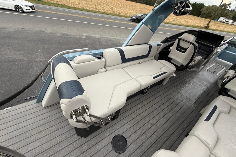 Slide: The Image of 2026 Avalon 2585 Excalibur boat interior with modern dashboard and luxurious seating. - 15