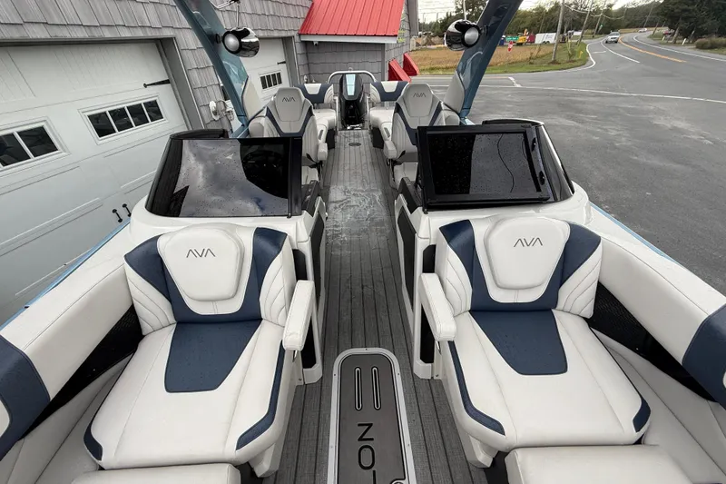 Slide: The Image of Luxurious seating on 2026 Avalon 2585 Excalibur Windshield Quad Lounger boat. - 22