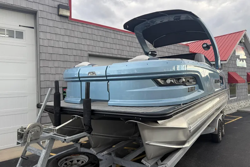 Slide: The Image of 2026 Avalon 2585 Excalibur Tri-toon boat with Mercury 400hp V-10 engine, docked outdoors. - 4