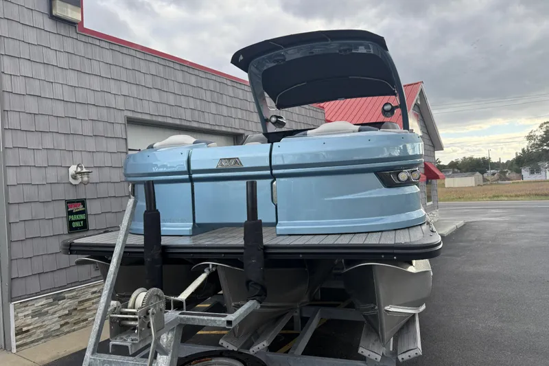 Slide: The Image of 2026 Avalon 2585 Excalibur Tri-toon boat with Mercury 400hp V-10 engine, docked. - 5