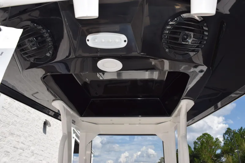 Slide: The Image of 2026 Yamaha Boats 255 FSH Sport H T-top with speakers and lighting. - 10