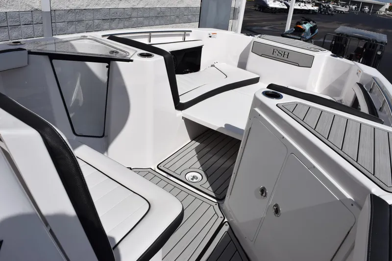 Slide: The Image of 2026 Yamaha Boats 255 FSH Sport H interior, featuring sleek seating and modern design elements. - 14