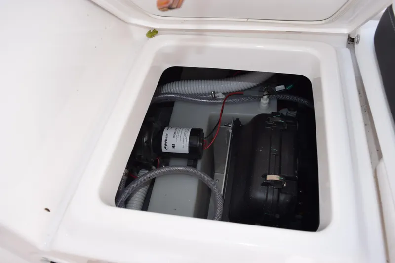 Slide: The Image of 2026 Yamaha Boats 255 FSH Sport H engine compartment with visible wiring and components. - 24