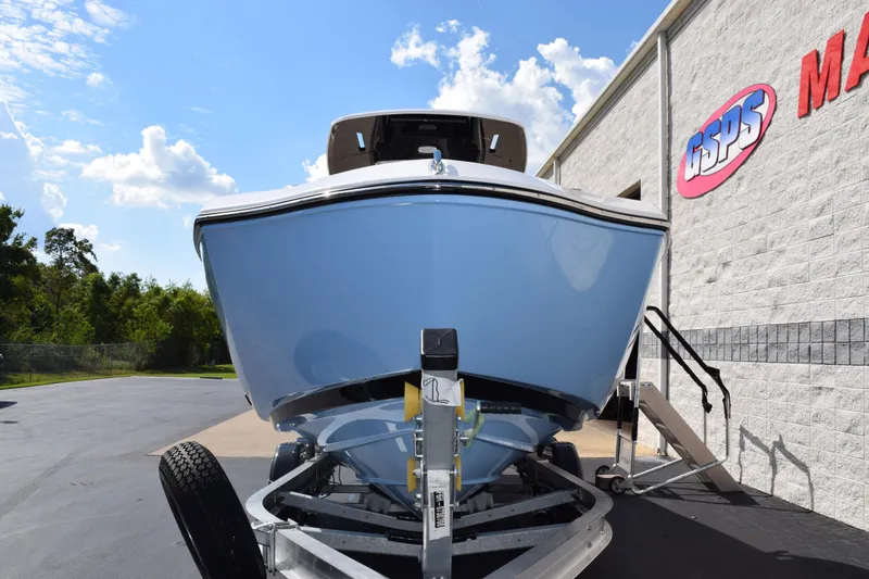 Slide: The Image of 2026 Yamaha Boats 255 FSH Sport H on trailer, parked outside dealership. - 3