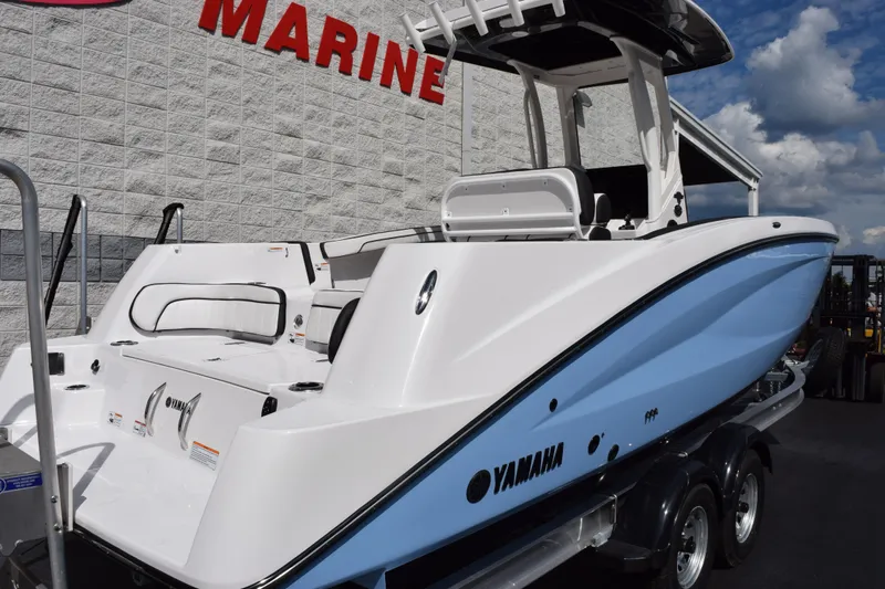 Slide: The Image of 2026 Yamaha Boats 255 FSH Sport H in marina, showcasing sleek design and modern features. - 4