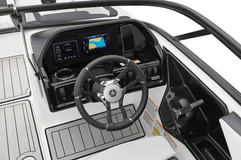 Slide: The Image of Manufacturer Provided Image: 2026 Yamaha Boats 195S dashboard with steering wheel and navigation display. - 7