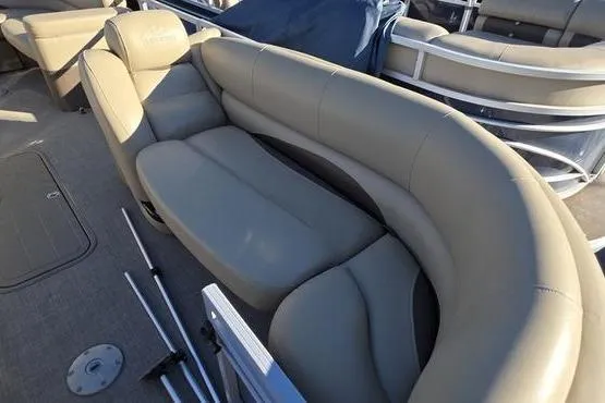 Slide: The Image of 2017 Regency 254 DL3 pontoon boat with beige seating and deck accessories. - 20