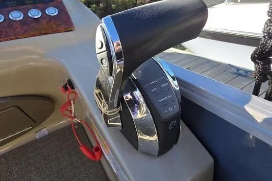 Slide: The Image of Throttle control of a 2017 Regency 254 DL3 boat, featuring a sleek design. - 28