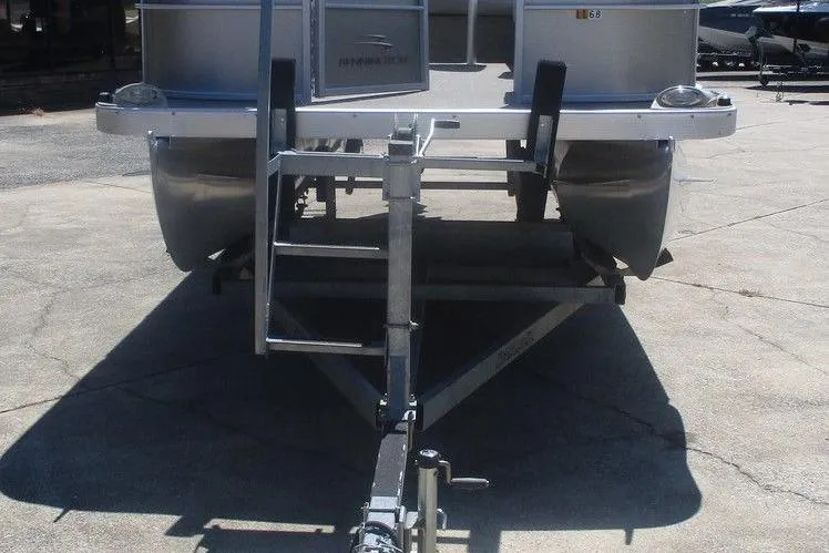 Slide: The Image of 2013 Bennington 20SL pontoon boat on trailer, front view with ladder. - 3