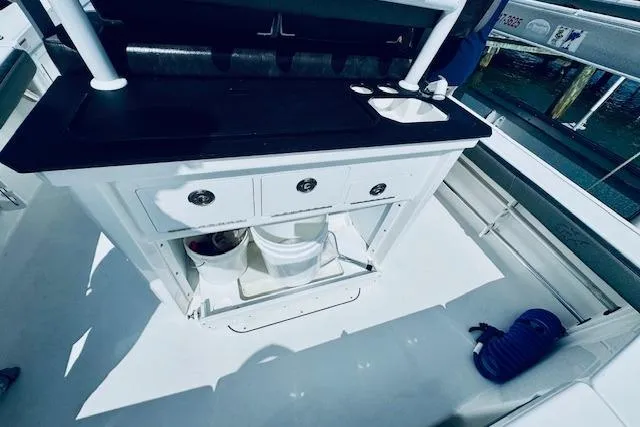 Slide: The Image of 2021 Crevalle 26 HCO boat interior with storage and sink area. - 10