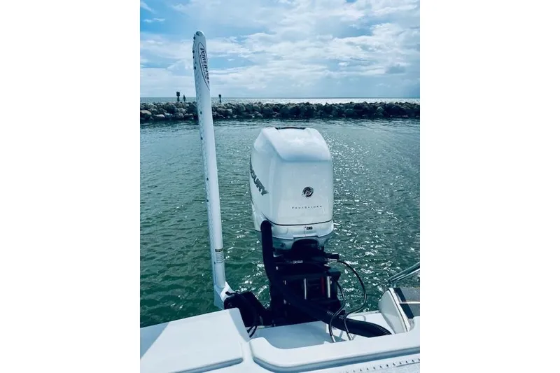 Slide: The Image of 2021 Crevalle 26 HCO boat with Mercury outboard motor on calm water. - 15