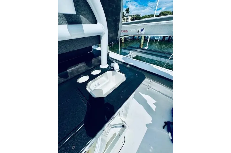 Slide: The Image of 2021 Crevalle 26 HCO boat interior with sink and storage area. - 8