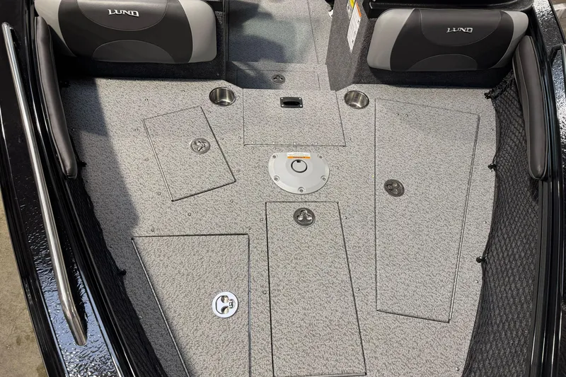 Slide: The Image of 2026 Lund 1975 Tyee boat interior with storage compartments and seating. - 10