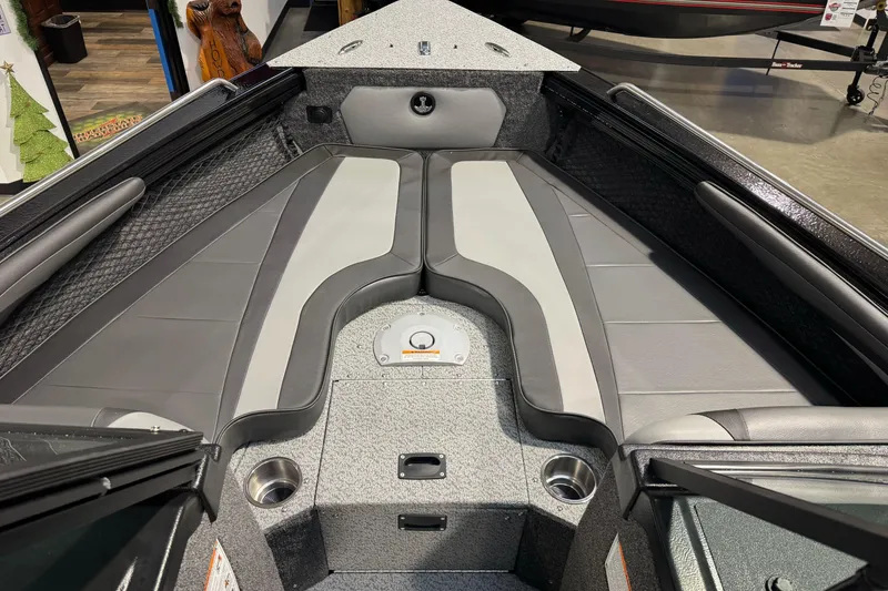 Slide: The Image of 2026 Lund 1975 Tyee boat interior with gray seating and cup holders. - 12