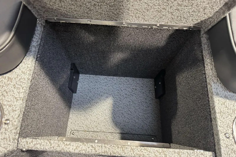 Slide: The Image of Interior storage compartment of 2026 Lund 1975 Tyee boat, carpeted and spacious. - 13