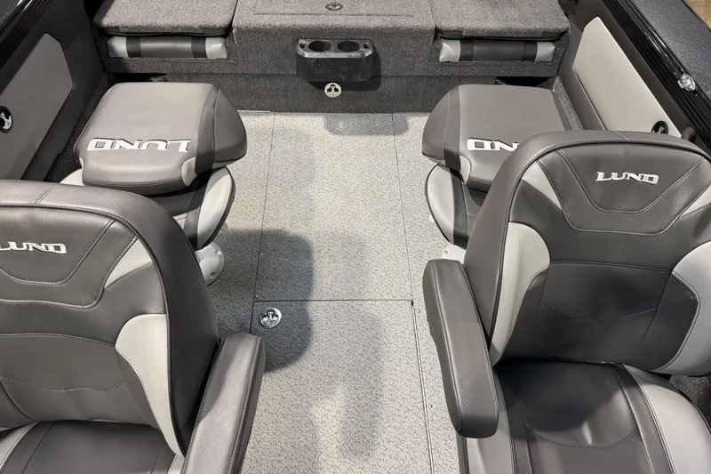 Slide: The Image of Interior of 2026 Lund 1975 Tyee boat with gray and black seating. - 15