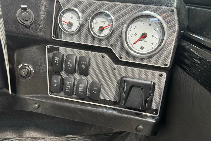 Slide: The Image of Dashboard of 2026 Lund 1975 Tyee boat with gauges and control switches. - 19