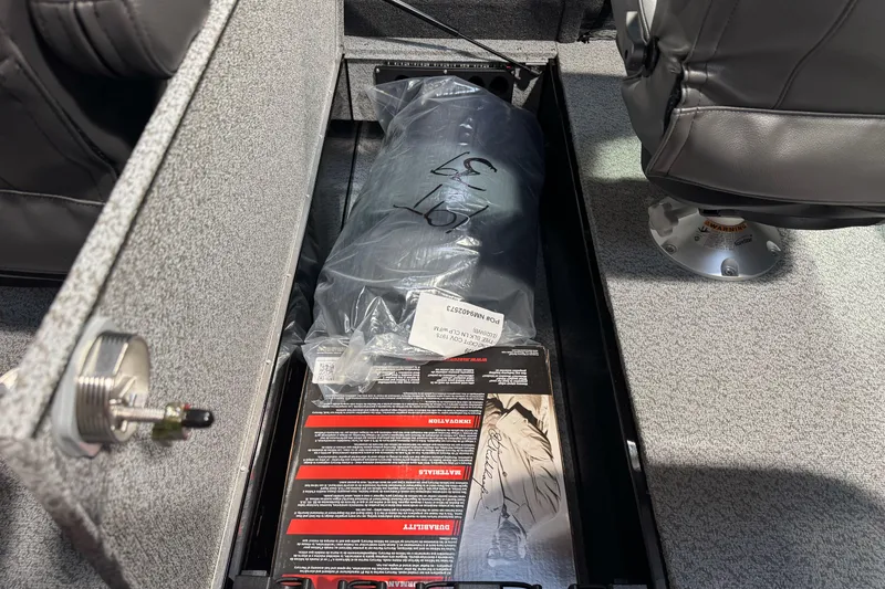 Slide: The Image of Storage compartment in 2026 Lund 1975 Tyee boat with packaged items inside. - 22