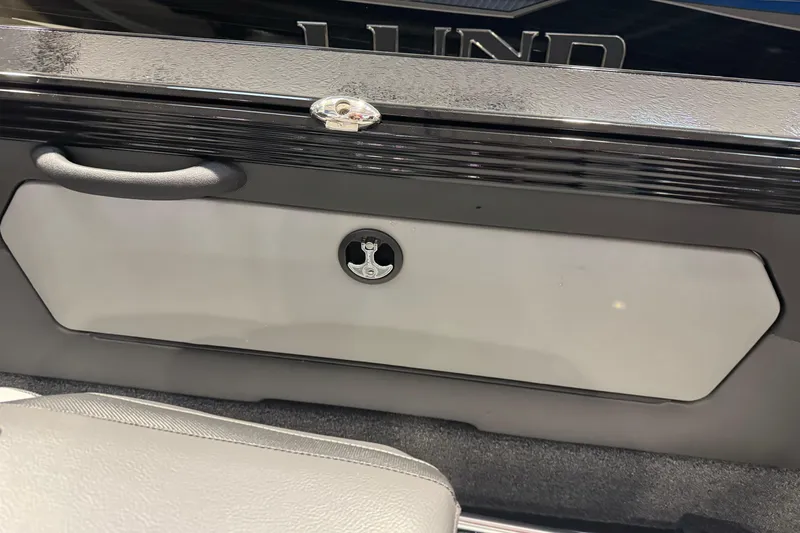 Slide: The Image of Interior storage compartment of 2026 Lund 1975 Tyee boat, featuring sleek design and secure latch. - 24