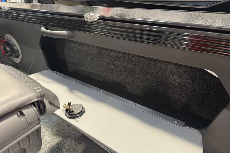 Slide: The Image of Interior of 2026 Lund 1975 Tyee boat, featuring seating and storage area. - 25