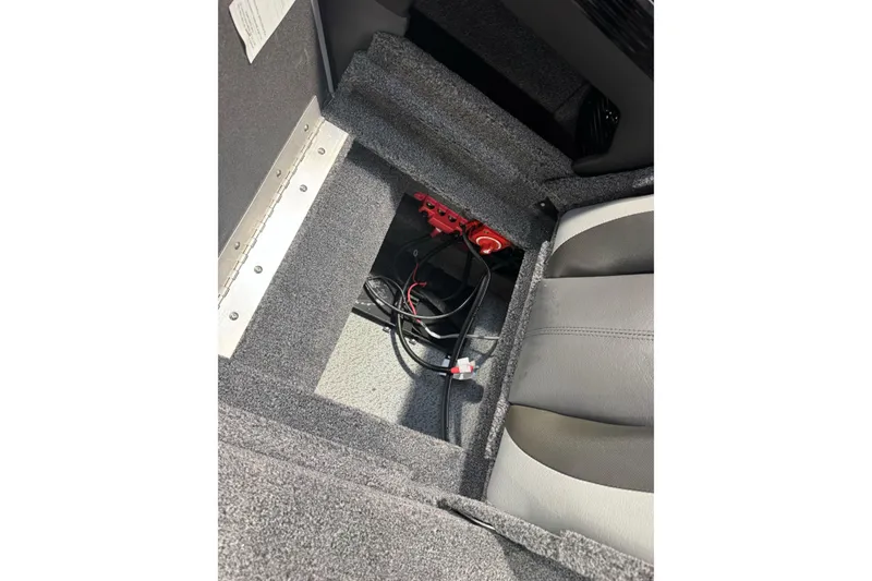 Slide: The Image of Interior view of 2026 Lund 1975 Tyee boat showing storage compartment with wiring. - 27