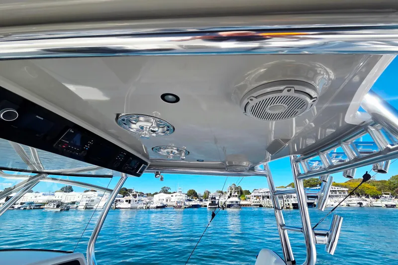 Slide: The Image of 2024 Valhalla Boatworks V-41 interior with advanced controls and sleek design on the water. - 12