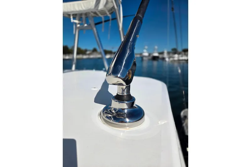 Slide: The Image of Close-up of 2024 Valhalla Boatworks V-41 deck hardware with marina background. - 14