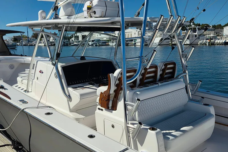 Slide: The Image of 2024 Valhalla Boatworks V-41, luxury fishing boat docked in marina, sleek design. - 16