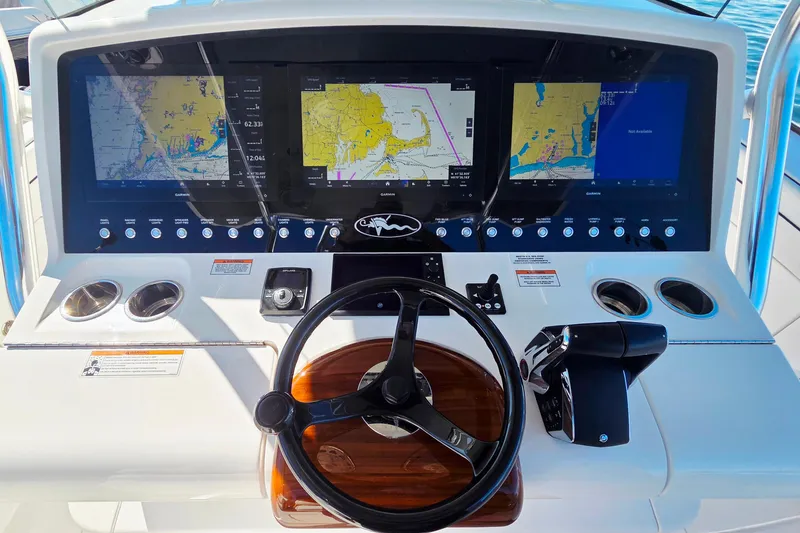 Slide: The Image of 2024 Valhalla Boatworks V-41 helm with advanced navigation displays and controls. - 17