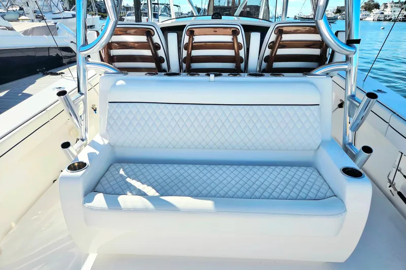 Slide: The Image of 2024 Valhalla Boatworks V-41 interior with luxurious seating and rod holders. - 18