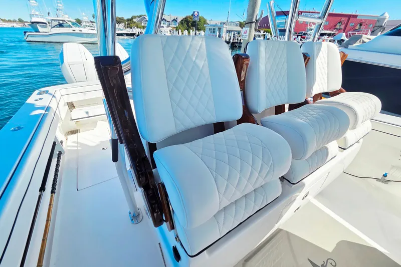 Slide: The Image of 2024 Valhalla Boatworks V-41 with luxurious white quilted seating, docked at marina. - 20